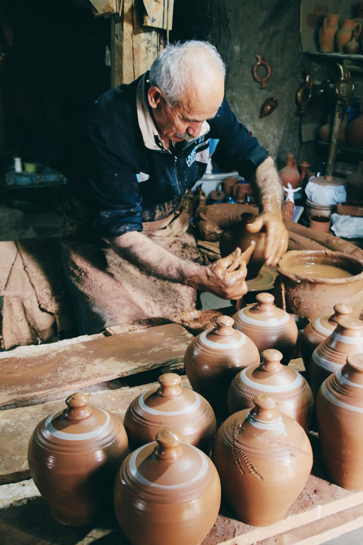 Elderly Potter Working